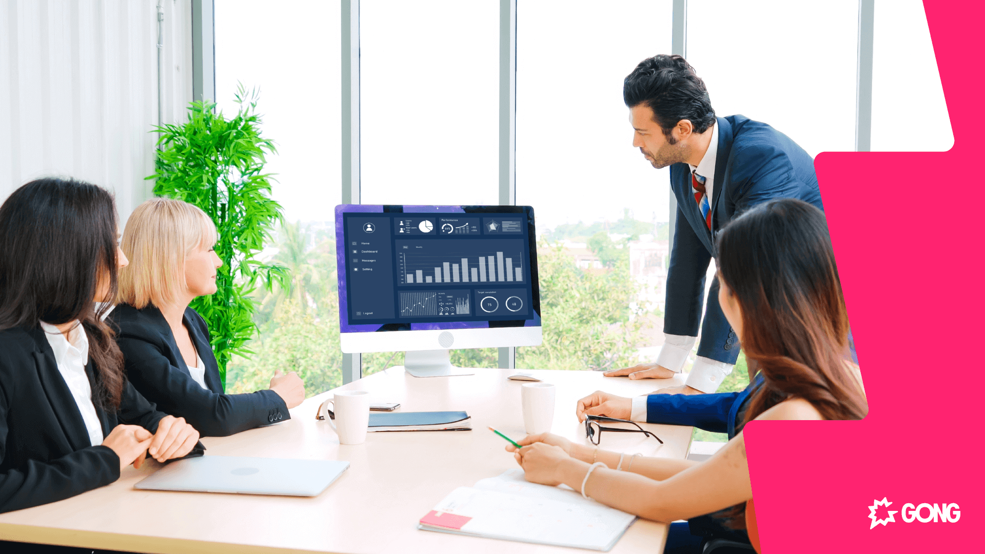 Boardroom of executives viewing an analytics dashboard